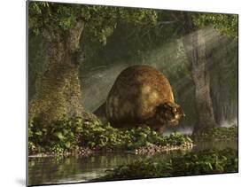 A Large Glyptodon Stands Near the Edge of a Stream-null-Mounted Art Print
