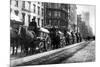 A Line Of Horse-Drawn Wagons Hauling Snow In New York City-null-Mounted Art Print