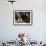 A Little Boy Holding a Banana Whilst Other Children Gaze Longingly at It-null-Framed Photographic Print displayed on a wall