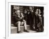 A Little Boy Holding a Banana Whilst Other Children Gaze Longingly at It-null-Framed Photographic Print