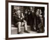 A Little Boy Holding a Banana Whilst Other Children Gaze Longingly at It-null-Framed Photographic Print