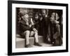 A Little Boy Holding a Banana Whilst Other Children Gaze Longingly at It-null-Framed Photographic Print