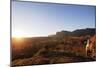 A local man warming up in the morning sun, Andringitra National Park, Ambalavao, central area, Mada-Christian Kober-Mounted Photographic Print