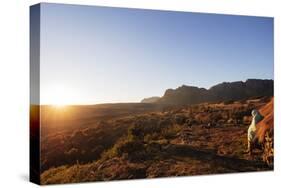 A local man warming up in the morning sun, Andringitra National Park, Ambalavao, central area, Mada-Christian Kober-Stretched Canvas