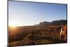 A local man warming up in the morning sun, Andringitra National Park, Ambalavao, central area, Mada-Christian Kober-Mounted Photographic Print