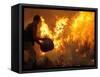 A Local Resident Throws a Bucket of Water on a Forest Fire-null-Framed Stretched Canvas