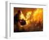 A Local Resident Throws a Bucket of Water on a Forest Fire-null-Framed Photographic Print