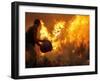 A Local Resident Throws a Bucket of Water on a Forest Fire-null-Framed Photographic Print