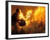 A Local Resident Throws a Bucket of Water on a Forest Fire-null-Framed Photographic Print