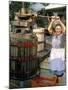 A Local Winemaker Pressing Her Grapes at the Cantina, Torano Nuovo, Abruzzi, Italy-Michael Newton-Mounted Photographic Print