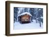 A log cabin is decorated with holiday lights and a green wreath on the door, Alaska-Design Pics-Framed Photographic Print