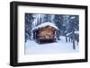 A log cabin is decorated with holiday lights and a green wreath on the door, Alaska-Design Pics-Framed Photographic Print