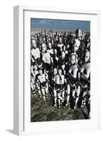 A Lone Android with a Human Flesh Colored Face Amongst a Crowd of Robots-null-Framed Art Print