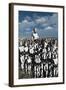 A Lone Android with a Human Flesh Colored Face Amongst a Crowd of Robots-null-Framed Art Print