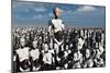 A Lone Android with a Human Flesh Colored Face Amongst a Crowd of Robots-null-Mounted Art Print