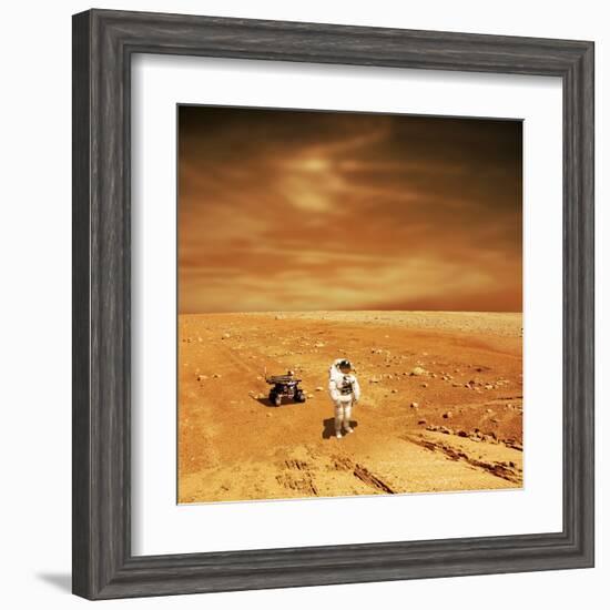 A Lone Astronaut Looks Up at the Sun While Exploring Mars-Stocktrek Images-Framed Art Print