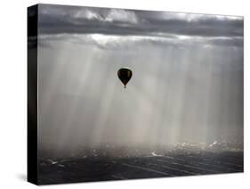 A Lone Balloon Drifts Near the Foothills of Albuquerque, N.M.-null-Stretched Canvas