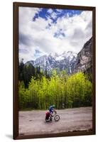 A Lone Cyclist Travels Along a Mountain Road with Trees and the Julian Alps in the Background-Sean Cooper-Framed Photographic Print