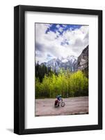 A Lone Cyclist Travels Along a Mountain Road with Trees and the Julian Alps in the Background-Sean Cooper-Framed Photographic Print