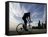 A Lone Cyclists Pedals Along Lake Michigan-null-Framed Stretched Canvas