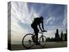 A Lone Cyclists Pedals Along Lake Michigan-null-Stretched Canvas