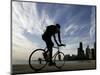 A Lone Cyclists Pedals Along Lake Michigan-null-Mounted Photographic Print