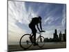 A Lone Cyclists Pedals Along Lake Michigan-null-Mounted Photographic Print