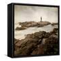 A Lone Man Standing on Large Rocks with the Seas Swirling around Them-Luis Beltran-Framed Stretched Canvas