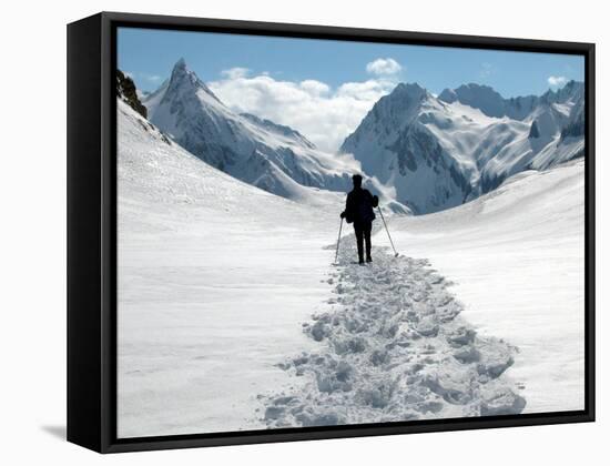 A Lone Mountain Hiker Walks in the Snow, Formazza Valley, Northern Italy-Fabio Polimeni-Framed Stretched Canvas