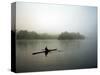 A Lone Rower Slowly Maneuvers His Craft Down the Schuykill River Through a Thick Fog-null-Stretched Canvas