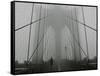 A Lone Runner Makes His Way Across the Fog-Shrouded Brooklyn Bridge Christmas Morning-null-Framed Stretched Canvas