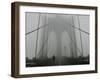 A Lone Runner Makes His Way Across the Fog-Shrouded Brooklyn Bridge Christmas Morning-null-Framed Premium Photographic Print