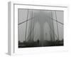 A Lone Runner Makes His Way Across the Fog-Shrouded Brooklyn Bridge Christmas Morning-null-Framed Premium Photographic Print