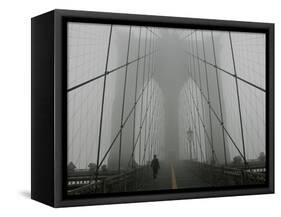 A Lone Runner Makes His Way Across the Fog-Shrouded Brooklyn Bridge Christmas Morning-null-Framed Stretched Canvas