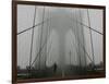 A Lone Runner Makes His Way Across the Fog-Shrouded Brooklyn Bridge Christmas Morning-null-Framed Photographic Print