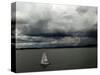 A Lone Sailboat Makes its Way Along Folsom Lake as Heavy Storm Clouds Approach-null-Stretched Canvas