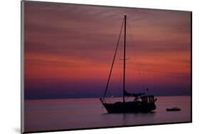 A Lone Sailboat Sits on Quiet Water at Dawn Just before Sunrise Off Tilghman Island, Maryland-Karine Aigner-Mounted Photographic Print