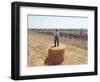 A Lone Spectator Watches the Pack Ride by from the Top of a Bale of Hay-null-Framed Photographic Print