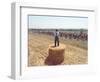 A Lone Spectator Watches the Pack Ride by from the Top of a Bale of Hay-null-Framed Photographic Print