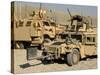 A M1114 Humvee Sits Parked in Front of a MaxxPro MRAP-Stocktrek Images-Stretched Canvas