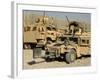 A M1114 Humvee Sits Parked in Front of a MaxxPro MRAP-Stocktrek Images-Framed Photographic Print