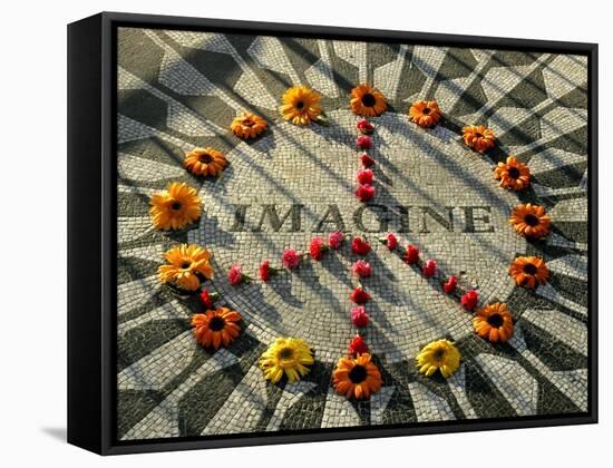 A Makeshift Peace Sign of Flowers Lies on Top John Lennon's Strawberry Fields Memorial-null-Framed Stretched Canvas