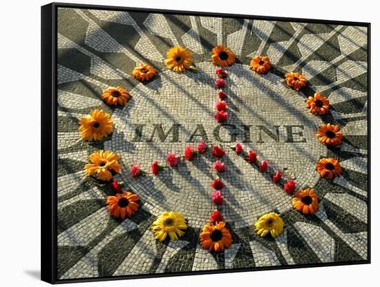 A Makeshift Peace Sign of Flowers Lies on Top John Lennon's Strawberry Fields Memorial-null-Framed Stretched Canvas