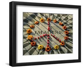 A Makeshift Peace Sign of Flowers Lies on Top John Lennon's Strawberry Fields Memorial-null-Framed Premium Photographic Print