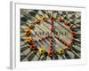 A Makeshift Peace Sign of Flowers Lies on Top John Lennon's Strawberry Fields Memorial-null-Framed Photographic Print