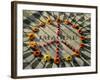 A Makeshift Peace Sign of Flowers Lies on Top John Lennon's Strawberry Fields Memorial-null-Framed Photographic Print