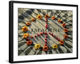 A Makeshift Peace Sign of Flowers Lies on Top John Lennon's Strawberry Fields Memorial-null-Framed Photographic Print