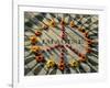 A Makeshift Peace Sign of Flowers Lies on Top John Lennon's Strawberry Fields Memorial-null-Framed Photographic Print