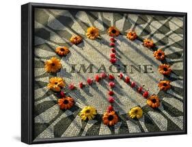 A Makeshift Peace Sign of Flowers Lies on Top John Lennon's Strawberry Fields Memorial-null-Framed Photographic Print