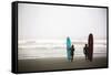 A Male And Female Surfer Hold Their Surfboards In The Olympic National Park In Washington State-Ben Herndon-Framed Stretched Canvas